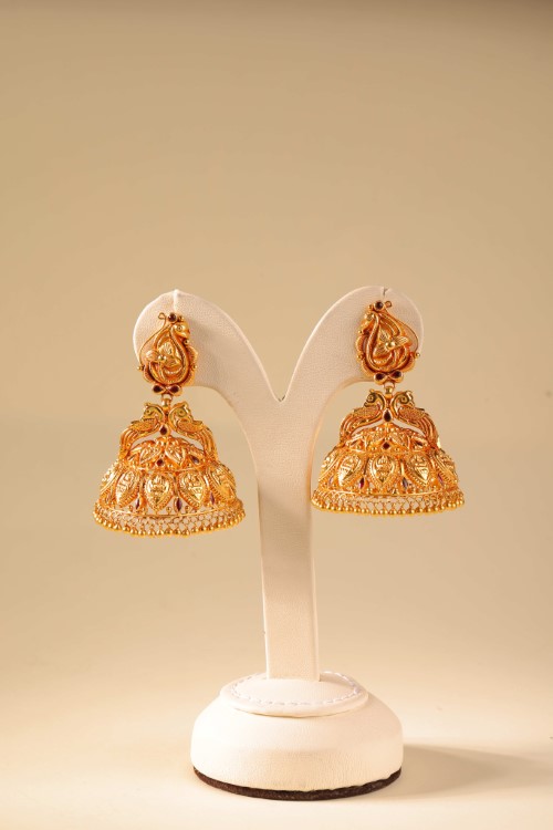 Gold jhumka earrings — TNN